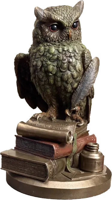 A statue of an owl standing on top of a stack of books